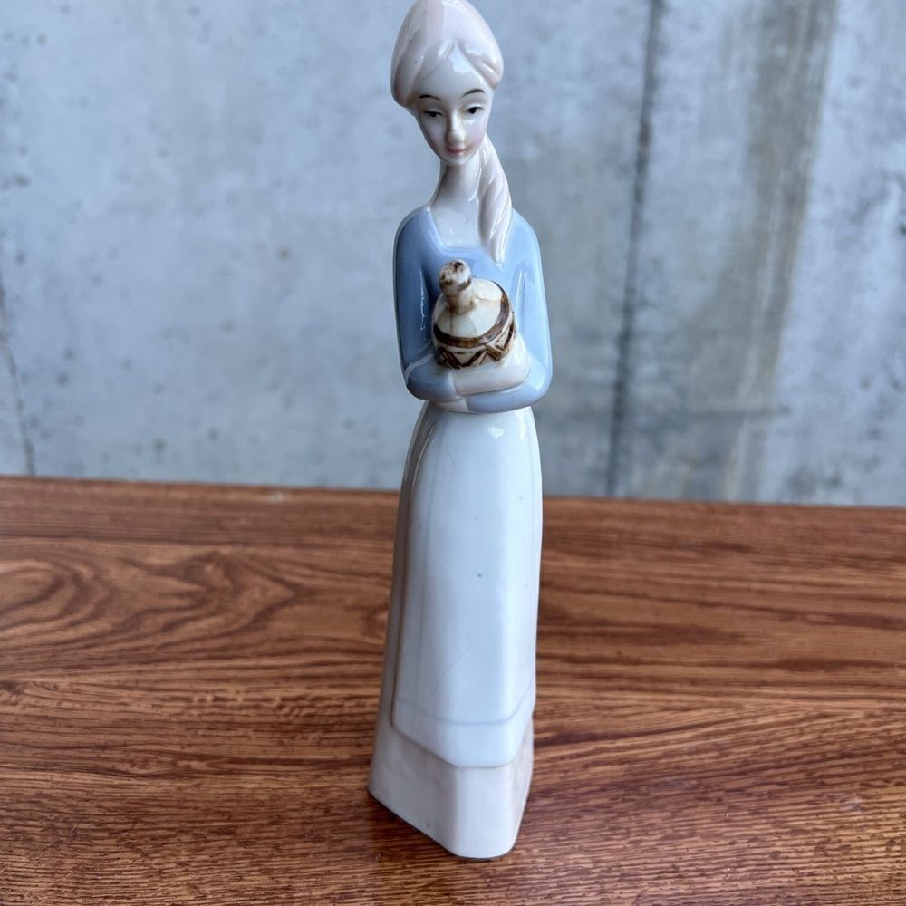 Porcelain Pheasant Lady Holding A Jug Good Condition